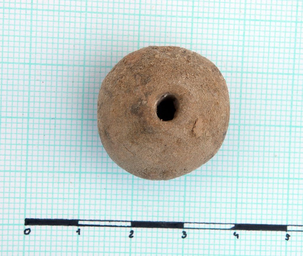 Spindle whorl (?)