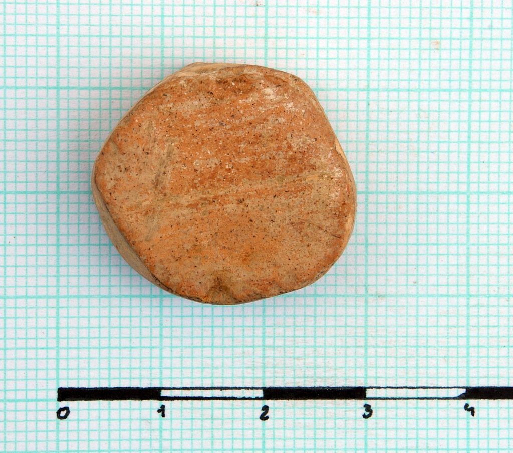 Rounded smooth ceramic sherd